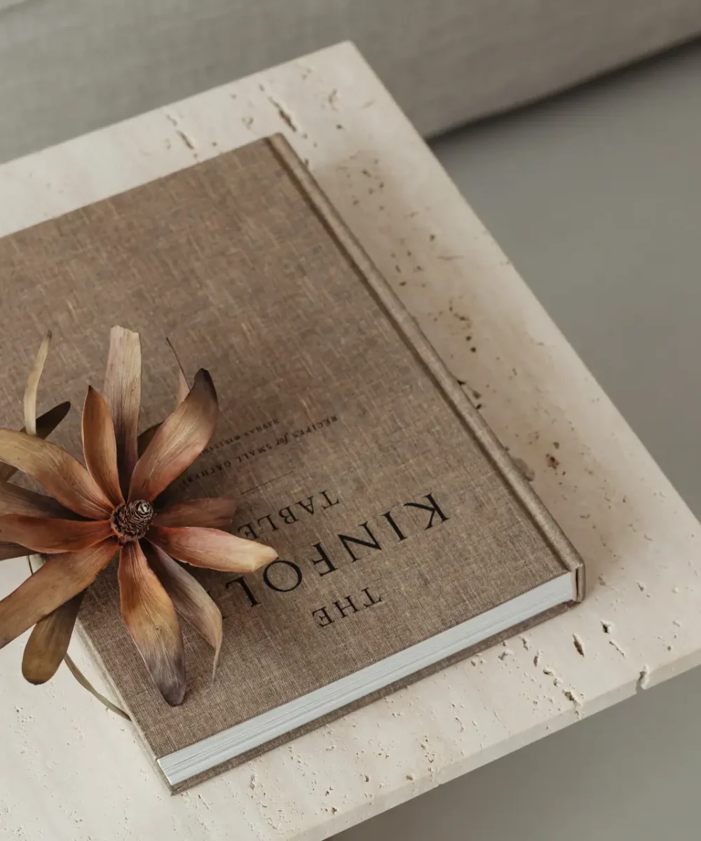 kaboompics_the-book-lies-on-a-travertine-table-kinfolk-dried-flower-27371